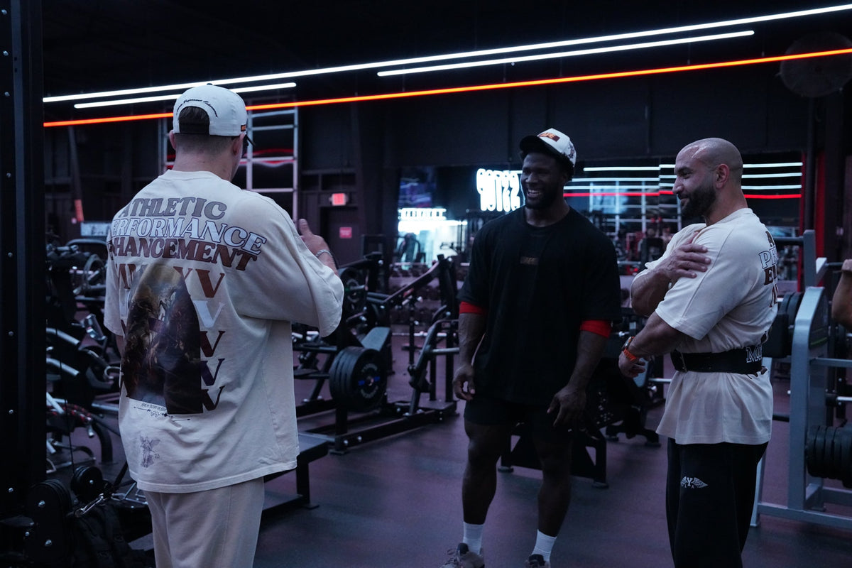 Athletes in oversized APE pump covers in the gym